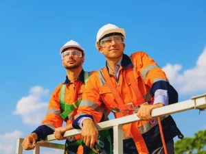 Technician working outdoor at wind turbine field.