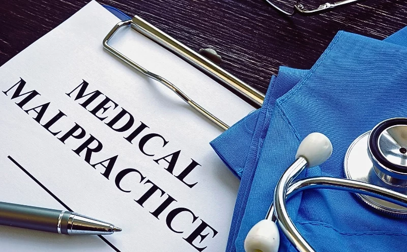 Medical malpractice. Medical suit, stethoscope and documents.