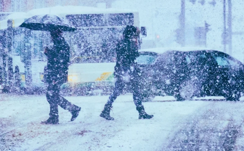 Pedestrians and traffic on a winter day. leading causes of unsafe driving